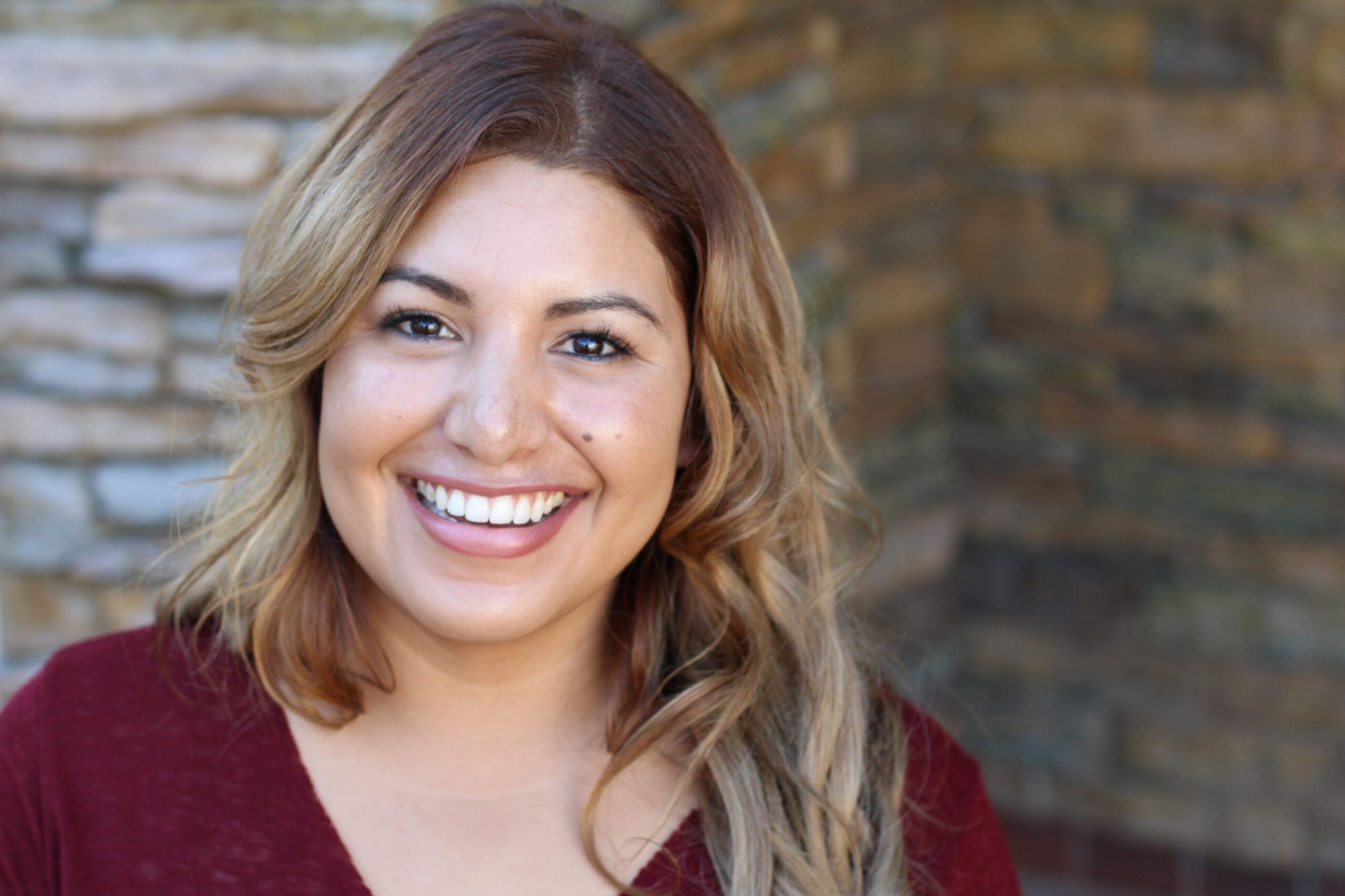 Close-up portrait of an attractive young woman smiling